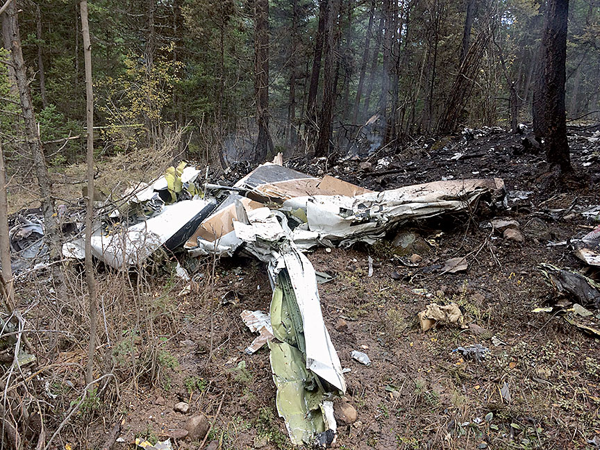 Overview of Cessna Citation wreckage showing fuselage and one of the wings from another angle
