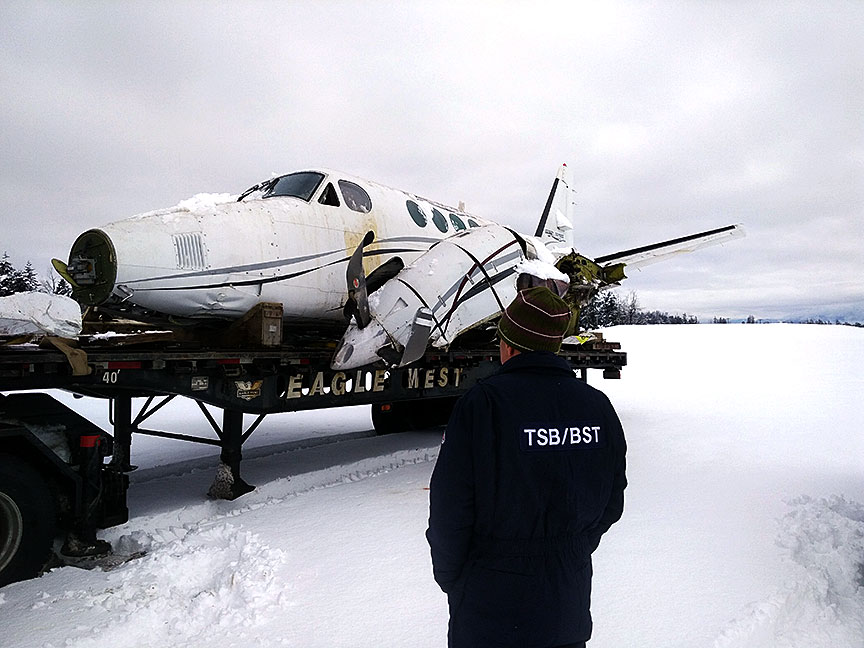 Photo of Wreckage of the Beech King Air being moved to a secure location for further analysis