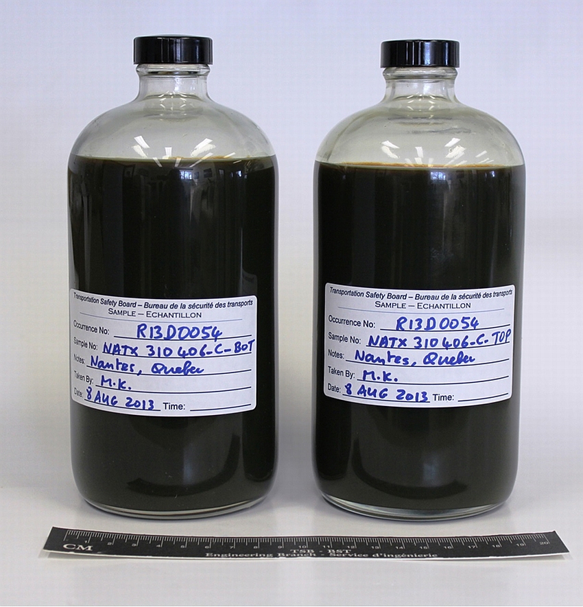 Figure 1 : Photograph showing 2 representative occurrence crude oil samples (NATX310406-C-BOT and NATX310406-C-TOP)