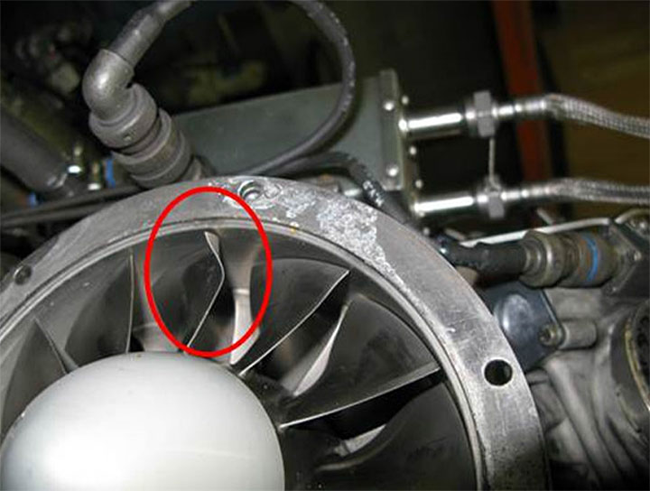Image of compressor blades with damage highlighted, described in section 1.16.3