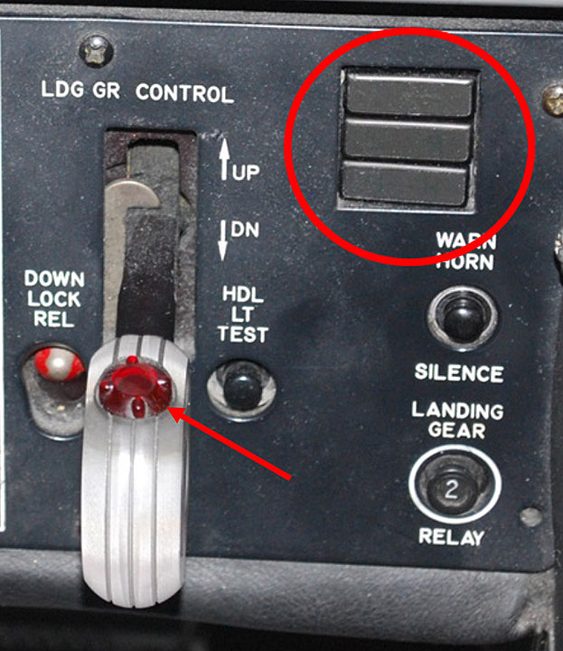 Beechcraft 1900D gear‑down indicator lights and landing gear control handle