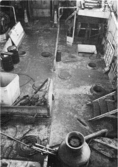  Main deck looking forward towards port bow. Note open manholes and door to port of winch drum. 