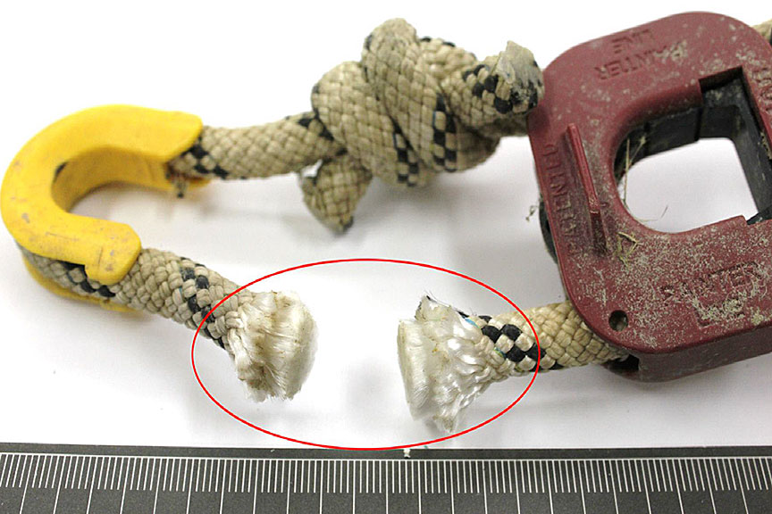 Photo showing the clean cut of the hydrostatic release unit's life raft rope