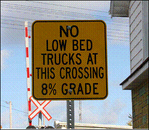 Low bed trucks warning signs installed at and on the approach to the Quabbin Road crossing after the occurrence