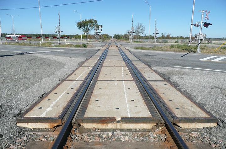 Image looking eastward from the west end of the crossing, train wheel flange marks were observed from the middle of the crossing extending westward