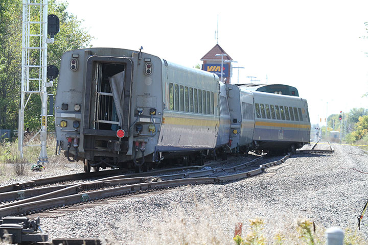 Image of the westward view of derailed cars and displaced track