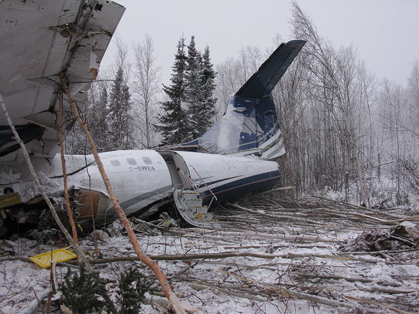 Left side view – back of aircraft wreckage showing aft left passenger door
