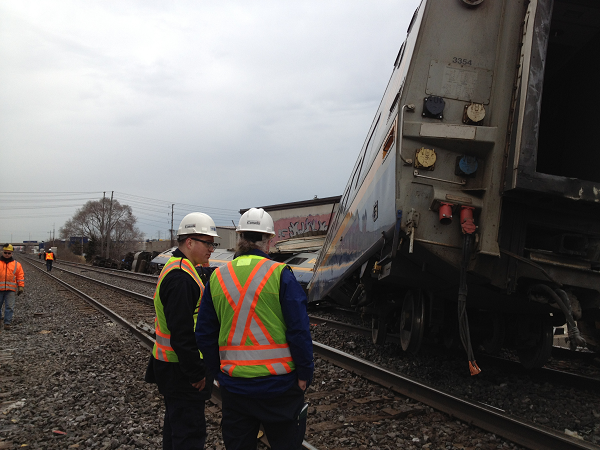 Two Transportation Safety Board Invesigators examine the occurrence site
