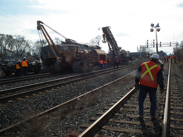 Investigators at the site as the occurrence train is being righted