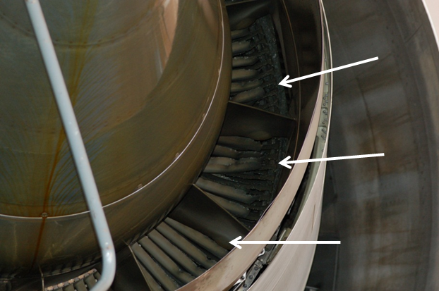 Photo showing the damage to the low-pressure turbine blades at the aft end of the engine