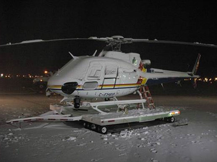 Image of an AS 350 B3 at a snow trail, described above