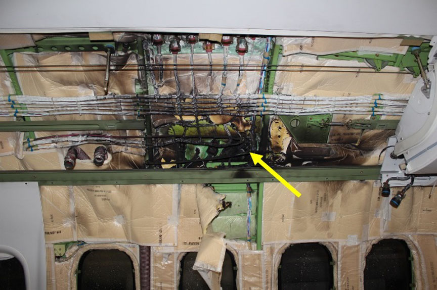 Area of heat damage at row 14 of the occurrence aircraft, shown with left cabin wall upholstery removed