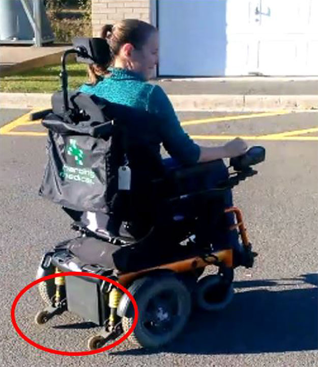 Motorized wheelchair similar to the occurrence wheelchair, with the anti-tippers circled