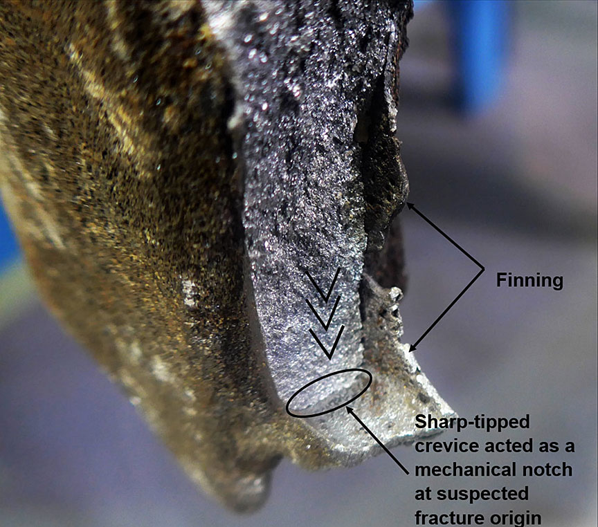 Chevrons pointing back to fracture origin at thermite welding finning anomaly