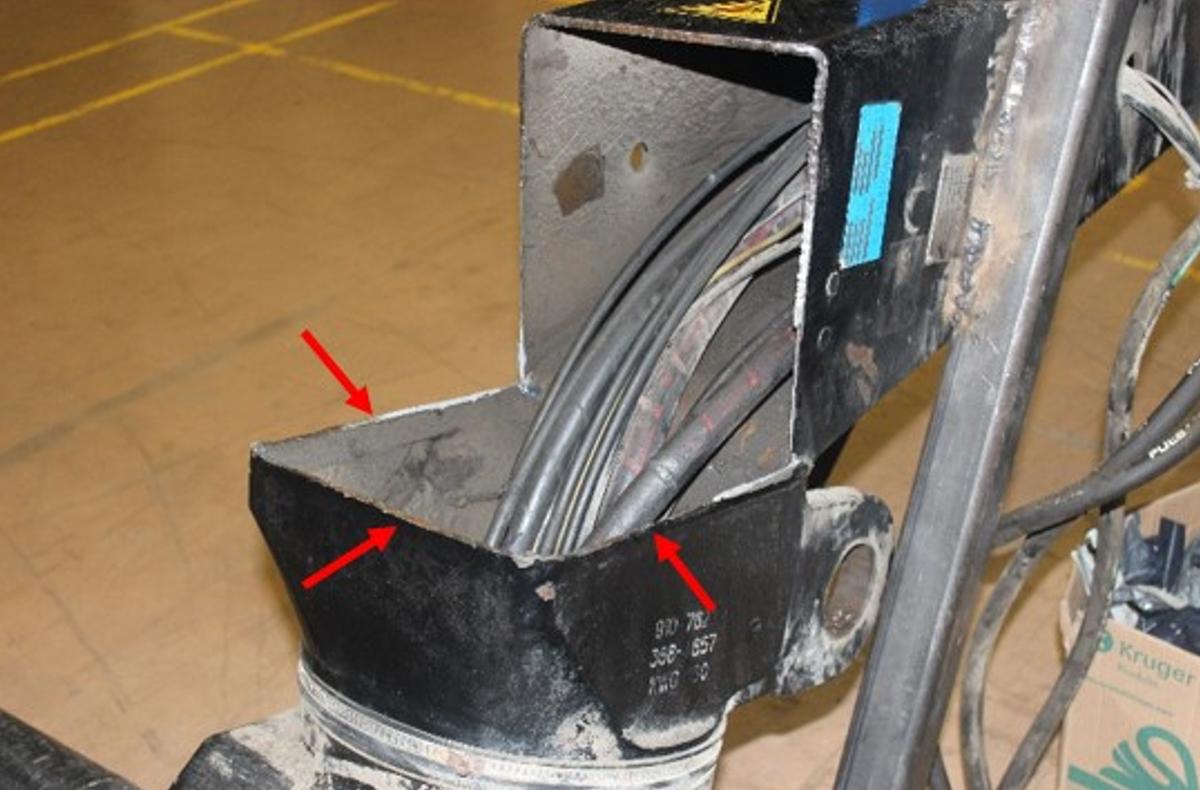 Location of the failure of the crane column weld, indicated by the red arrows