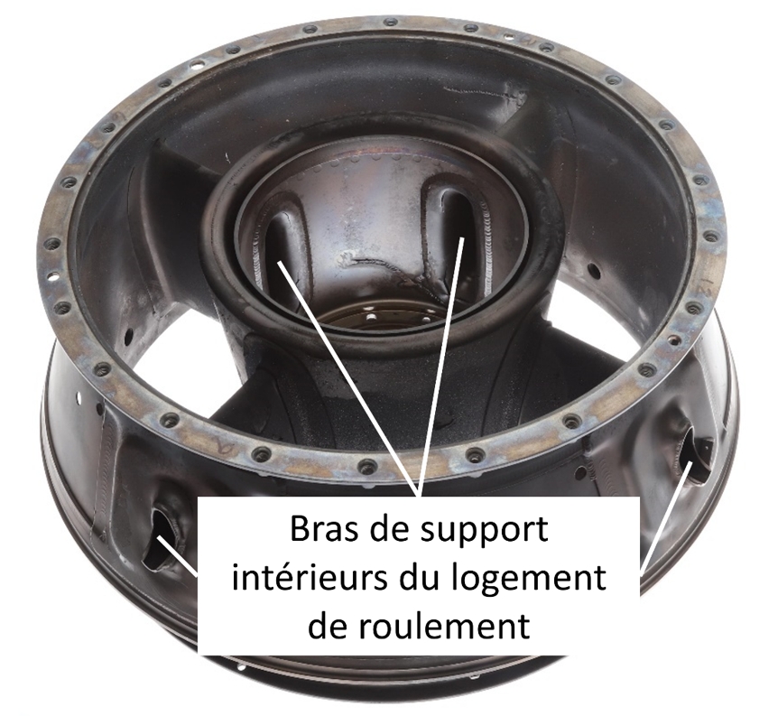 Figure 7. Diffuseur d’échappement montrant les bras de support intérieurs du logement de roulement (Source : BST) Figure 7. Diffuseur d’échappement montrant les bras de support intérieurs du logement de roulement (Source : BST)