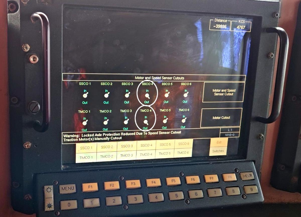Figure 7. Control monitor and keyboard on locomotives in the ES44AC series; the monitor is displaying the “Motor and Speed Sensor Cutouts” screen, with a circle around the SSCO 4 and the TMCO 4 toggle switches 